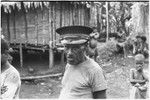 Wanumbil, Wanuma Census Division: man in police-style cap, women in background cross their arms