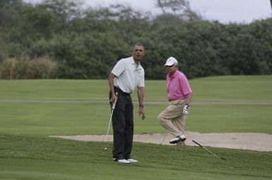 Barack Obama plays golf with Prime Minister Najib Razak, Joe Paulsen, and Mike Brush in Kaneohe Bay, Hawaii, December 24, 2014