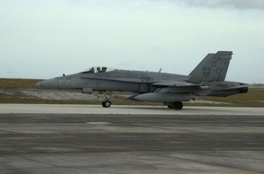 An US Marine Corps (USMC) F/A-18C Hornet aircraft assigned to Marine Fighter Attack Squadron One Two Two (VMFA-122), taxies onto the runway during exercise Jungle Shield, at Anderson Air Force Base (AFB) Guam