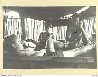 DENIKI, NEW GUINEA. 1944-04-10. MEMBERS OF THE 23RD LINE SECTION, 18TH LINES OF COMMUNICATION SIGNALS DURING A REST PERIOD. IDENTIFIED PERSONNEL ARE:- VX91161 SIGNALMAN A.R. NICOLSON (1); V503456 ..