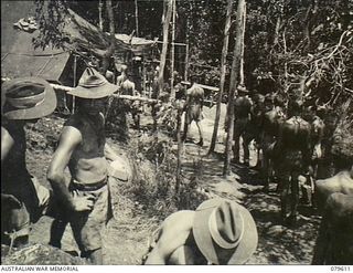 Oro Bay, New Guinea. 1943-04. A mess parade at the 10th Field Ambulance, Army Medical Corps