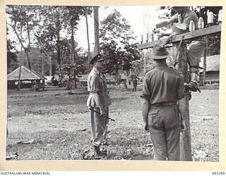 NADZAB AREA, NEW GUINEA, 1945-06-27. HIS ROYAL HIGHNESS, THE DUKE OF GLOUCESTER, GOVERNOR GENERAL OF AUSTRALIA (1) WATCHING SGT D.H. GORDON (3) AND LT S.W. MOORE (2) LAYING A PERMANENT LINE, AT ..