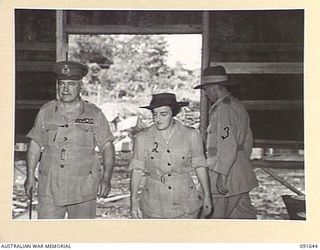 LAE, NEW GUINEA. 1945-05-11. GENERAL SIR THOMAS A. BLAMEY, COMMANDER-IN-CHIEF, ALLIED LAND FORCES, SOUTH WEST PACIFIC AREA (1), ACCOMPANIED BY LIEUTENANT COLONEL M.J. SPENCER, ASSISTANT CONTROLLER ..