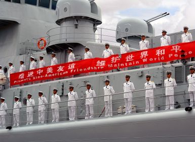 Chinese Peoples Liberation Army Navy Sailors from the Luhu Class (Type 052) Guided Missile Destroyer QINGDAO (DDG 113) man the rails as their ship arrives at Naval Station Pearl Harbor, Hawaii, for a Goodwill Visit on Sept. 6, 2006. The visit provides an excellent opportunity to enhance cooperation between the two navies and underscores the United States commitment to supporting ongoing cooperative efforts in the Pacific Region. (U.S. Navy photo by CHIEF Mass Communication SPECIALIST Joe Kane) (Released)