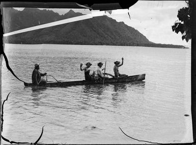 [Four people in a canoe]