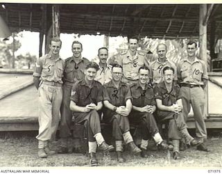 LAE, NEW GUINEA. 1944-04-01. THE OFFICER STAFF AT G BRANCH, HEADQUARTERS LAE BASE SUB AREA. IDENTIFIED PERSONNEL ARE: NX92138 SERGEANT W. CHAPMAN (1); V4826 WARRANT OFFICER CLASS 2 N.J. MCDONALD ..