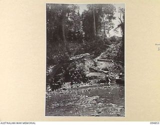 ILIPEM, NEW GUINEA. 1945-07-31. TROOPS OF 2/5 INFANTRY BATTALION, AT THE MOST FORWARD YMCA COFFEE STAFF IN THE YAMIL AREA WHICH WAS ESTABLISHED BY MR A.K. HILLIS, YMCA REPRESENTATIVE. IT IS ..