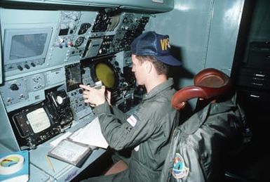 Aviation Anti-submarine Warfare Operator First Class R.S. Tait sits at central station 3 and preflights the magnetic anomaly detection (MAD) equipment in the P-3 Orion trainer