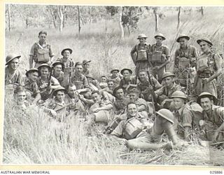 PORT MORESBY, PAPUA. 1942-07-11. AUSTRALIAN INFANTRY CONDUCTING MANOEUVRES IN DENSE TROPICAL BUSH IN NEW GUINEA. HERE SOME OF THE TROOPS ARE RESTING DURING A BREAK IN THE EXERCISE