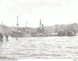 RABAUL, NEW BRITAIN, 1945-12-13. SHIPPING BERTHED AT BURNS PHILPS TOWN WHARF. THESE INCLUDE ARMY VESSELS, A GOVERNMENT SALVAGE BOAT, AND SALVAGED JAPANESE SHIPPING