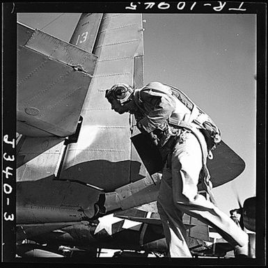 Navy TBM pilots hurrying to their planes aboard the USS Monterey (CVL-26) for strike on Guam.