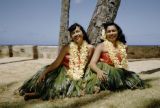 Oceania, women wearing Polynesian skirts and leis