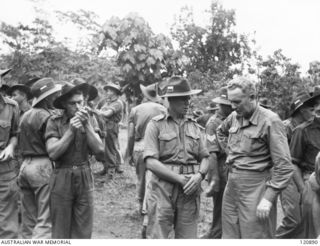 RABAUL, NEW BRITAIN. 1945-12-28. THE PRIME MINISTER OF AUSTRALIA, MR BEN CHIFLEY, ARRIVED BY PLANE TO VISIT MANY OF THE UNITS IN THE AREA. MR CHIFLEY CHATTING WITH AN UNIDENTIFIED MAJOR, 16TH ..