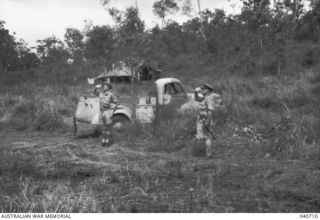 Sogeri, New Guinea. 1942-10-04. Major General A S Allen CB CBE DSO VD (right), Commanding 7th Australian Division, after reviewing a parade of the 21st Australian Infantry Brigade takes the salute, ..