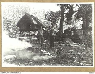WANDOKAI BEACH NEW GUINEA. 1943-12-31. AUSTRALIAN TROOPS IN A SECTION OF AN AMMUNITION DUMP ABANDONED BY THE JAPANESE FORCES NEAR THE BEACH