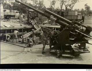 Pacific Area. c. 1942. Australian soldiers preparing a site to mount the anti aircraft gun in the foreground