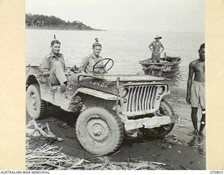 LABU, NEW GUINEA, 1944-03-03. QX34507 LIEUTENANT COLONEL W.J. REINHOLD, CBE, MC, COMMANDER ROYAL ENGINEERS (A.I.F.) (1) PICTURED WITH NX137962 SAPPER R. PATRICK, 9TH FIELD COMPANY (2), IN A JEEP ..