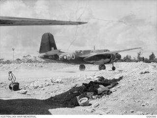 KIRIWINA, TROBRIAND ISLANDS, PAPUA. C. 1943-12. A BOSTON BOMBER AIRCRAFT, CODED DU-F, RAAF SERIAL NO. A28-5, OF NO. 22 SQUADRON RAAF TAXIING OUT FOR A MISSION ALONG THE COAST OF NEW BRITAIN