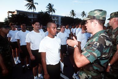 STAFF SGT. Dan Lee, a staff member of the Hawaii National Guard Youth Challenge program, gives a little instruction to one of the new corps members in the group. The program offers troubled youths a second chance at getting a high school education and improving their prospects for the future.(Published in AIRMAN Magazine May 1996 ) Exact Date Shot Unknown