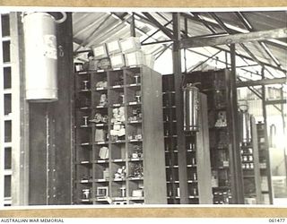 PORT MORESBY, NEW GUINEA. 1943-12-07. BINS IN THE ORDNANCE STORE OF THE NO. 3 SUB DEPOT, 10TH AUSTRALIAN ADVANCED ORDNANCE DEPOT