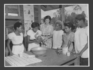 [Practical training in infant welfare being given to teacher trainees at Popondetta Higher Education Centre, New Guinea] / Australian News and Information Bureau, photograph by W. Brindle