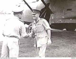 RABAUL, NEW BRITAIN, 1945-12-21. LIEUTENANT-GENERAL H. C. H. ROBERTSON, GENERAL OFFICER COMMANDING FIRST ARMY (2) BEING GREETED BY MAJOR-GENERAL K. W. EATHER, GENERAL OFFICER COMMANDING 11 DIVISION ..