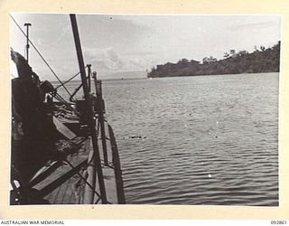 NANTAMBU, NEW BRITAIN. 1945-06. THE VIEW FROM THE DECK OF AN AMERICAN SMALL SHIP USED AS A REFRIGERATOR SHIP FOR MEAT. IT SHOWS THE BAY AT NANTAMBU