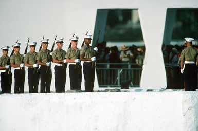 A Marine Corps firing party takes part in a Memorial Day observance at the USS ARIZONA Memorial