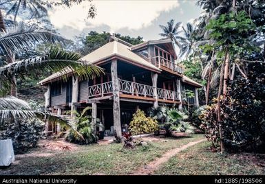Fiji - wooden two-story building with white balconies