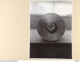 RABAUL, NEW BRITAIN. 1945-11-20. A PAPER COVERING OVER THE PRIMER OF A 75 MM SHELL CASE. THIS IS A JAPANESE PROTECTIVE INNOVATION