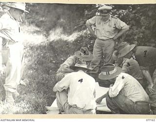 JACQUINOT BAY, NEW BRITAIN. 1944-11-21. CONFERENCE OF HIGH ARMY, RAN AND RAAF OFFICERS DEALING WITH A PROPOSED AIRSTRIP NEAR PALMALMAL PLANTATION. IDENTIFIED PERSONNEL ARE:- NX12229 ..