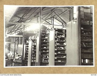 17 MILE, PORT MORESBY AREA, NEW GUINEA. 1943-12-13. INTERIOR OF THE ARTILLERY SPARE PARTS STORE AT NO. 3 SUB DEPOT, 10TH AUSTRALIAN ADVANCED ORDNANCE DEPOT