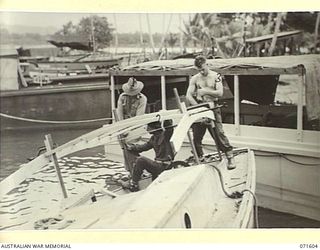 LABU POINT, LAE, NEW GUINEA. 1944-03-24. NX67984 SERGEANT R. J. HUDSON (1), NX65860 CRAFTSMAN (CFN) J. D. MITCHELL (2); AND QX31258 CFN C. R. NOUD (3), WORKSHOP CARPENTERS OF THE 1ST WATERCRAFT ..