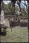 Tukwaukwa village on Kiriwina: houses, fishing nets (l)