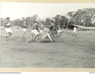 LAE, NEW GUINEA. 1944-11-18. AN EXCITING MOMENT AT THE GOAL MOUTH DURING A HOCKEY MATCH BETWEEN TEAMS FROM A COMPANY AND B COMPANY, 18TH FIELD AMBULANCE