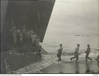 AITAPE AREA, NORTH EAST NEW GUINEA. C. 1944-04-22. RAAF GROUND CREWS CARRY STORES ASHORE FROM A LANDING SHIP, TANK (LST)