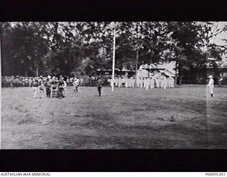 RABAUL, NEW BRITAIN. PROTECTORATE OF GERMAN NEW GUINEA. 1914-11-30. THE SCENE JUST BEFORE THE PUBLIC CANING IN PROCLAMATION SQUARE OF THE PERPETRATORS, GERMANS WEARING MASKS, OF THE ATTACK ON THE ..