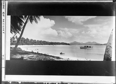 Fiji, shows beach, boat and people swimming