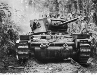 BOUGAINVILLE. 1945-04-26. A B SQUADRON, 2/4 ARMOURED REGIMENT MATILDA TANK SUPPORTED BY 24 INFANTRY BATTALION TROOPS, BOGGED WHILE MOVING FORWARD TO RELIEVE AN AMBUSHED TRACTOR TRAIN CARRYING ..