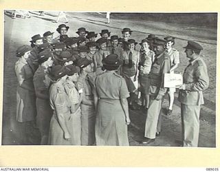 INDOOROOPILLY, QUEENSLAND. 1945-04-23. MAJOR GENERAL C.H. SIMPSON, (1), AND MAJOR H.T. MACREADY, (2), WITH NEW SOUTH WALES PERSONNEL CONCENTRATED AT 2 AUSTRALIAN WOMEN'S ARMY SERVICE BARRACK BEFORE ..