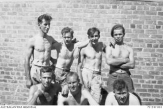 Probably  Ward's Airfield, New Guinea. 1942-12. Members of the Electrical Section, No. 1 Operational Training Unit (OTU) RAAF, at Ward Strip. Left to right: back row: Corporal Reg Little, Corporal ..