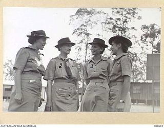 BRISBANE, QUEENSLAND. 1945-02-19. AUSTRALIAN WOMEN'S ARMY SERVICE OFFICERS ON DRAFT FOR NEW GUINEA WITH COLONEL S.H. IRVING, CONTROLLER AUSTRALIAN WOMEN'S ARMY SERVICE, (2), DURING HER VISIT TO 2 ..