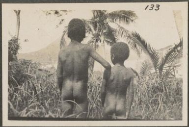 Two Papuan children on top of a mountain, New Britain Island, Papua New Guinea, probably 1916