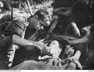 1942-10-19. NEW GUINEA. AUSTRALIAN TROOPS ADVANCE THROUGH OWEN STANLEY RANGES. JAP. PRISONER. THIS SOLDIER, LEFT TO DIE BY THIS COMRADES, WAS BROUGHT IN BY AN AUSTRALIAN PATROL