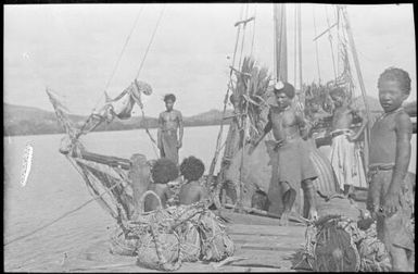 Trading vessel with crew at a jetty, Bootless Inlet, Papua, ca. 1923 / Sarah Chinnery