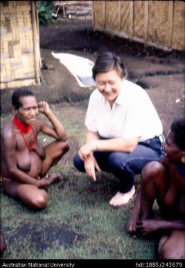 Marie Reay speaking with local people