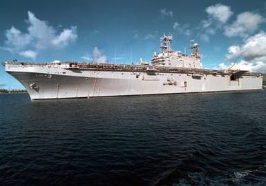 Port side view of the Amphibious Assault Ship USS BELLEAU WOOD (LHA 3) traversing the Harbor at Apra Harbor, Guam