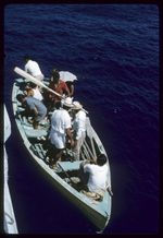 Members of the Marsters family aboard sailing cutter 'Twin' near reef off Palmerston Atoll, Cook Islands