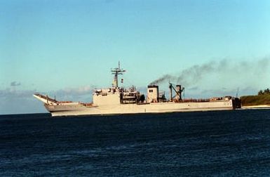 The tank landing ship USS BARBOUR COUNTY (LST-1195) heads out to sea as it departs Naval Station, Pearl Harbor, to return to Naval Station, San Diego, Calif., following its deployment to the Persian Gulf region for Operation Desert Shield and Operation Desert Storm.