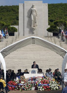 The Statue of Columbia, representation of America since 1775, overlooks Honolulu Mayor Jeremy Harris as he speaks to an audience of hundreds during the annual Mayor's Memorial Day Ceremony at The National Memorial Cemetery of the Pacific located in Honolulu, Hawaii (HI)